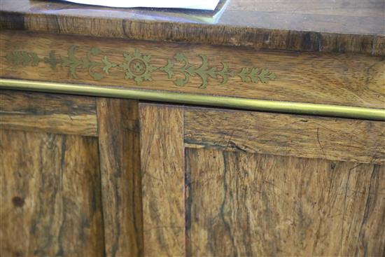 A Regency brass inset rosewood breakfront dwarf bookcase, with pierced brass three quarter gallery, two panelled and two pleated doors,